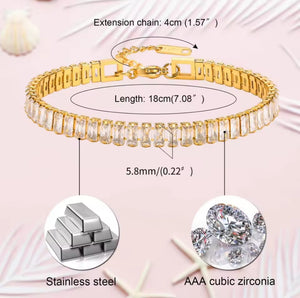 Gold bracelet with cubic zirconia stones on a pink background