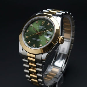 Luxury watch with green dial and gold accents on a black background