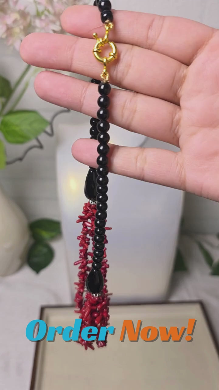 Red coral and black onyx handmade necklace close-up